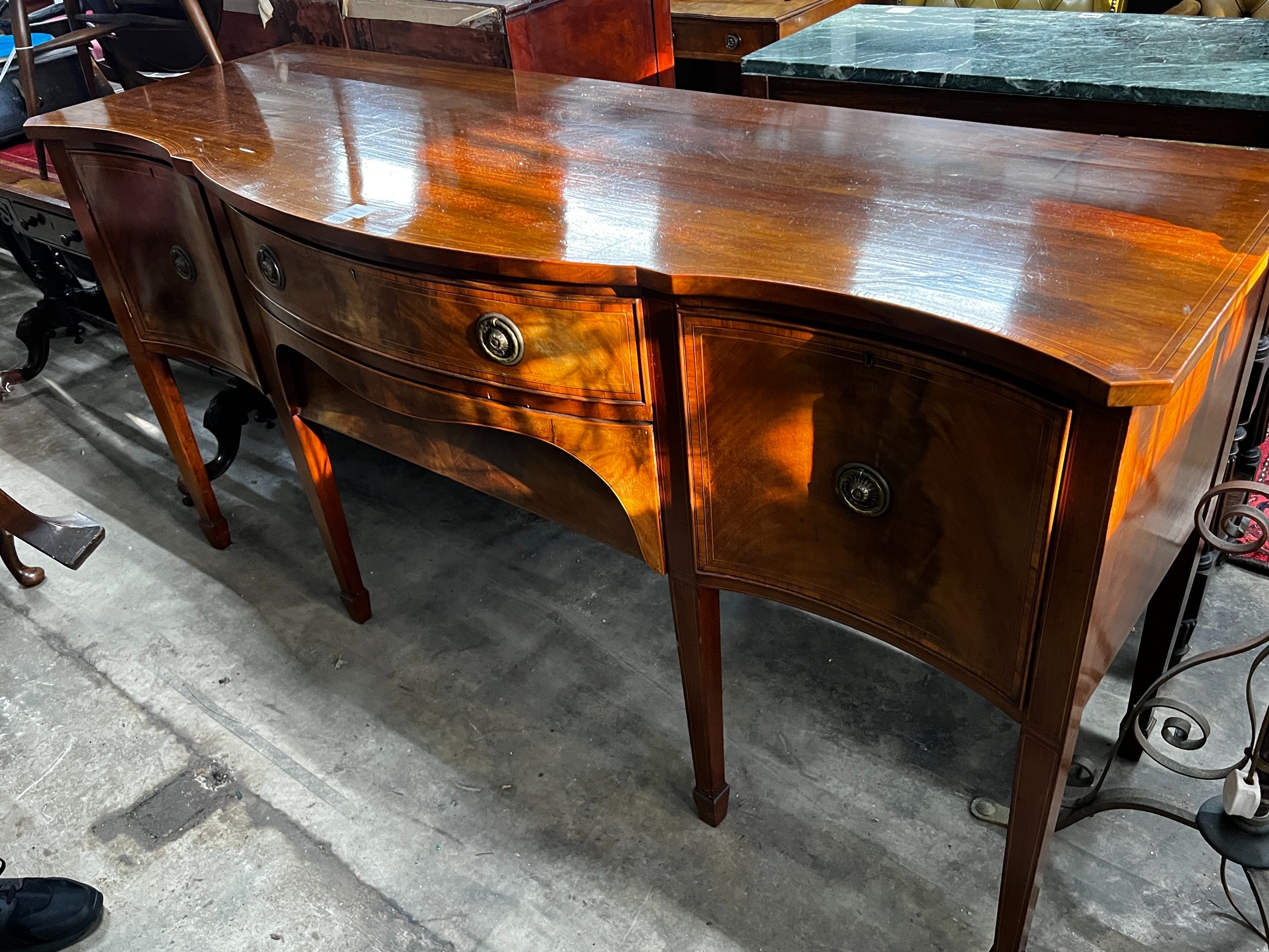 A George III style banded mahogany serpentine fronted sideboard, length 183cm, depth 64cm, height 92cm